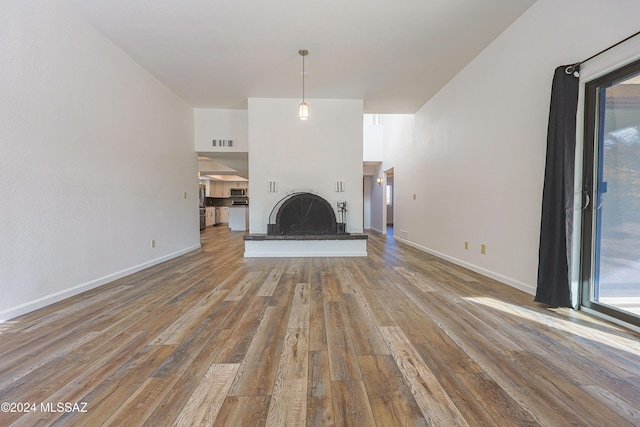 unfurnished living room with light hardwood / wood-style flooring