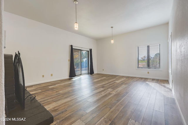 unfurnished living room with dark hardwood / wood-style floors