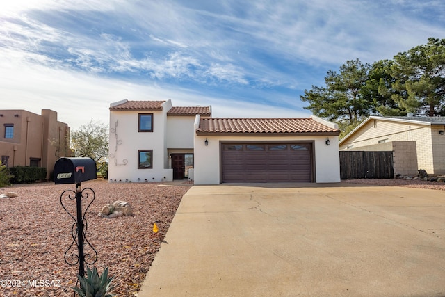 mediterranean / spanish-style house featuring a garage