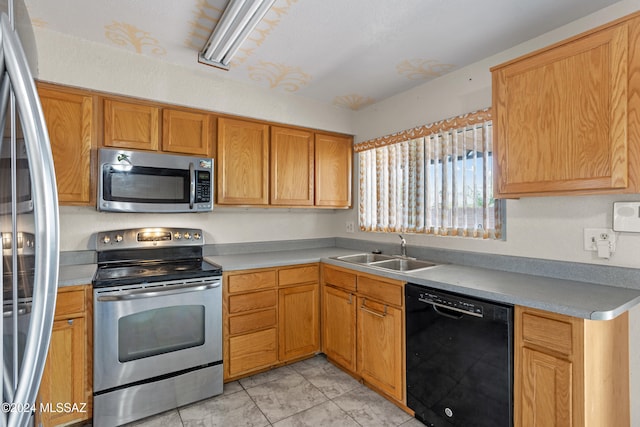 kitchen featuring stainless steel appliances and sink