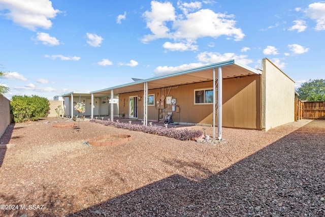 back of property with a patio