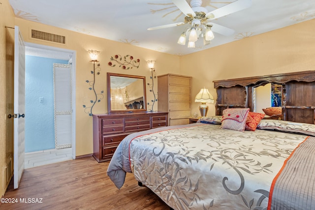 bedroom featuring ceiling fan and light hardwood / wood-style floors