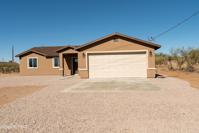 single story home with a garage