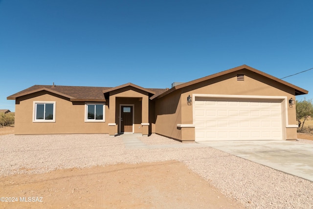 ranch-style home with a garage