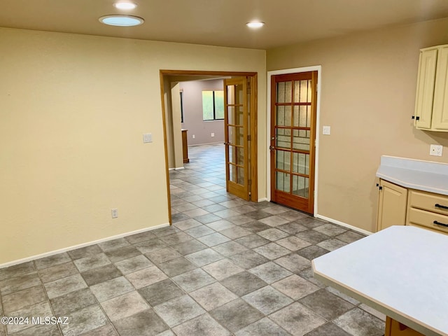 unfurnished dining area with french doors