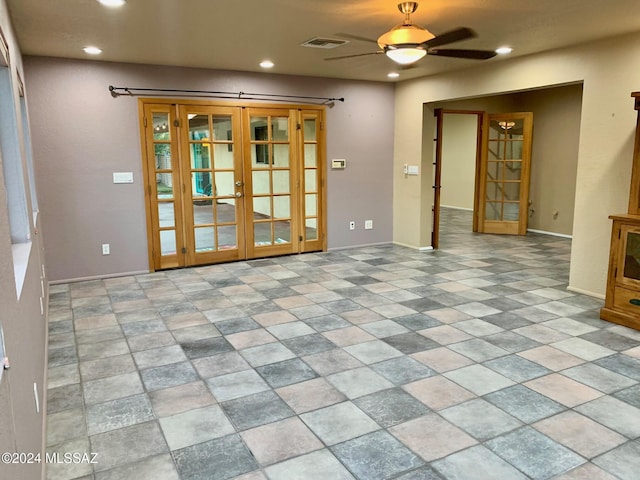 spare room with french doors and ceiling fan