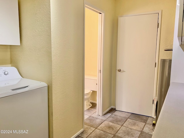 laundry area with washer / dryer