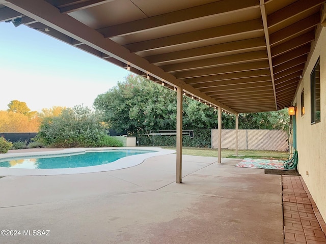 view of swimming pool with a patio area