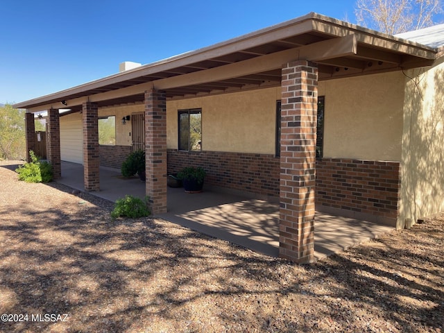 rear view of house featuring a patio area