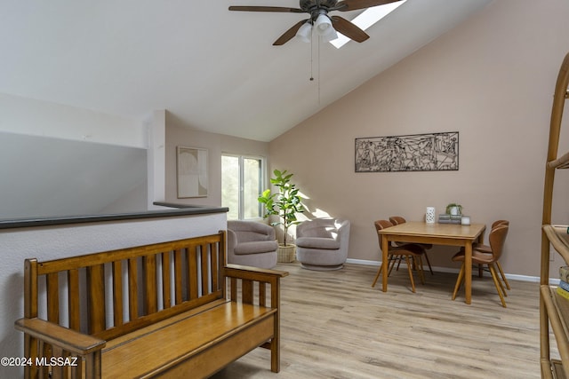 sitting room featuring ceiling fan, light hardwood / wood-style flooring, and lofted ceiling