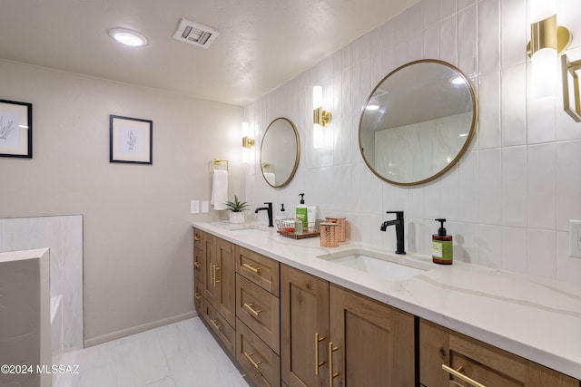 bathroom with vanity and tile walls