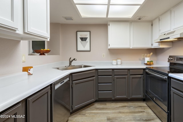 kitchen with white cabinets, stainless steel appliances, gray cabinetry, and sink