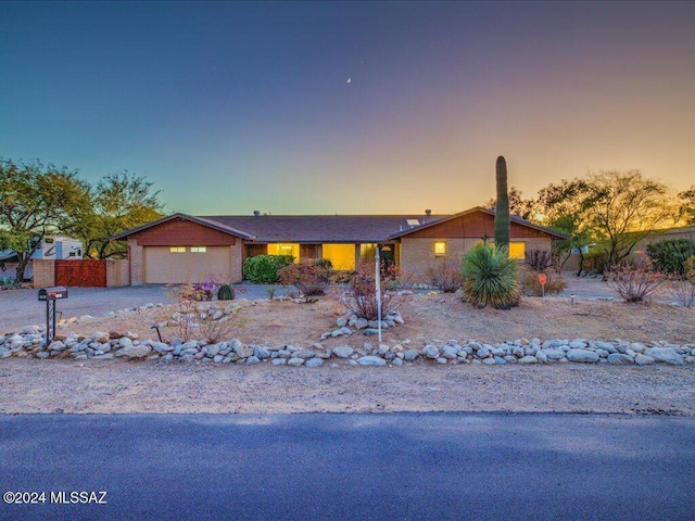 ranch-style home with a garage