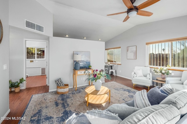 living room with ceiling fan, a healthy amount of sunlight, lofted ceiling, and dark wood-type flooring