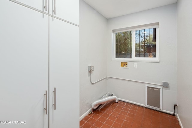 laundry room with cabinets and washer hookup