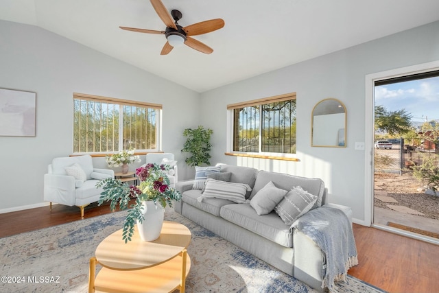 living room with hardwood / wood-style floors, plenty of natural light, ceiling fan, and vaulted ceiling