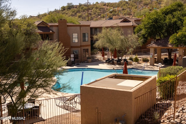 view of pool featuring a gazebo and a patio