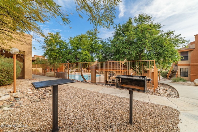 view of patio / terrace with a fenced in pool