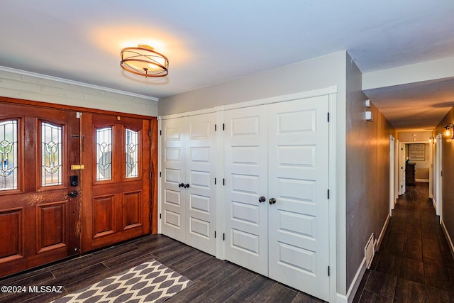 entryway with dark hardwood / wood-style floors