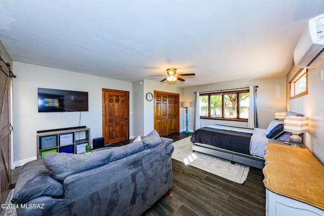 bedroom with a wall mounted AC, ceiling fan, and dark hardwood / wood-style floors