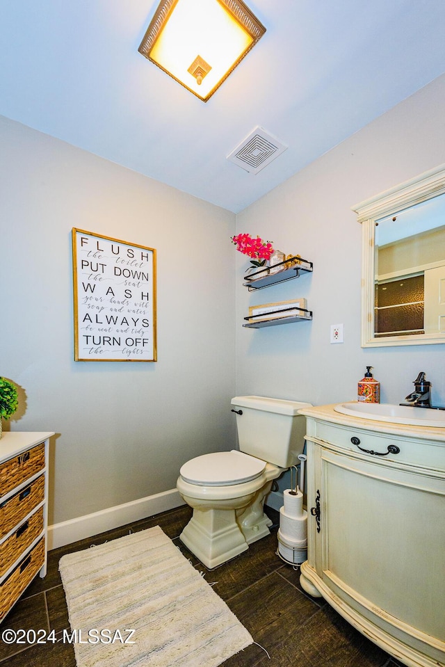 bathroom with vanity and toilet