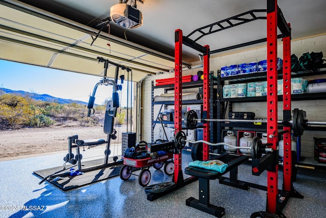 exercise room with a mountain view