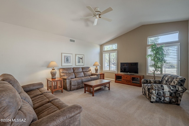 living room with ceiling fan, light carpet, and vaulted ceiling