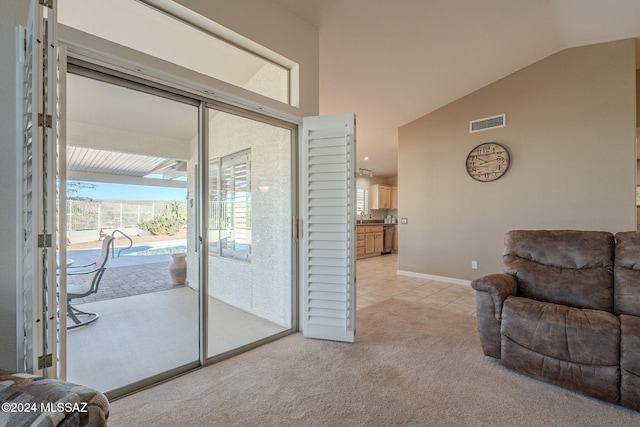 living room featuring light carpet and lofted ceiling