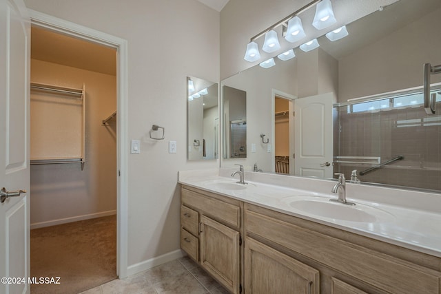 bathroom with vanity, tile patterned floors, and an enclosed shower