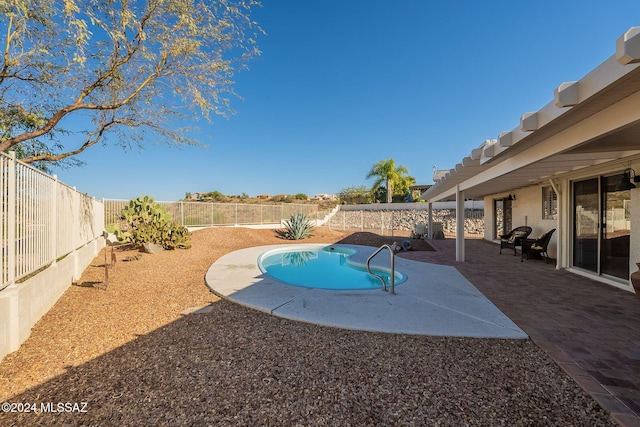 view of swimming pool featuring a patio