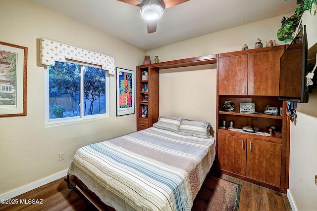 bedroom featuring ceiling fan and dark hardwood / wood-style flooring