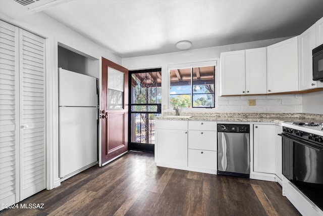 kitchen featuring white refrigerator, stainless steel dishwasher, gas stove, dark hardwood / wood-style flooring, and white cabinetry