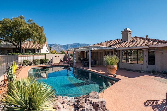 view of pool featuring a mountain view, a patio area, and a pergola