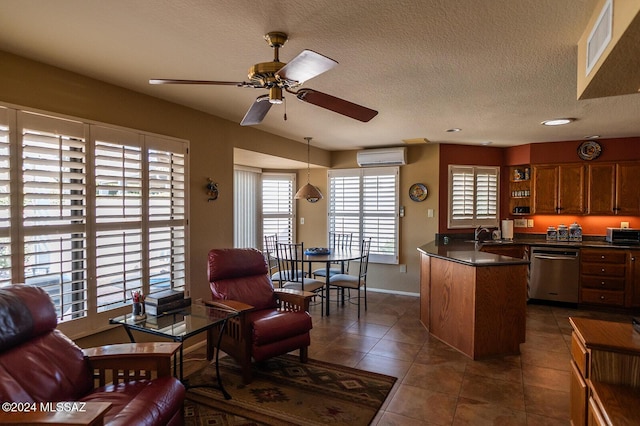 kitchen with dishwasher, ceiling fan, dark tile patterned floors, a textured ceiling, and a wall mounted AC