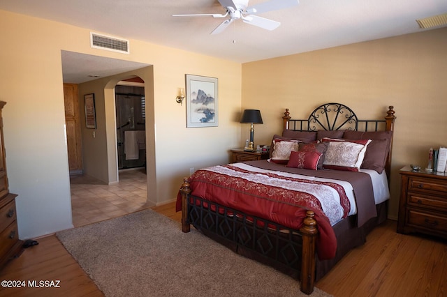 bedroom with ceiling fan and light hardwood / wood-style flooring