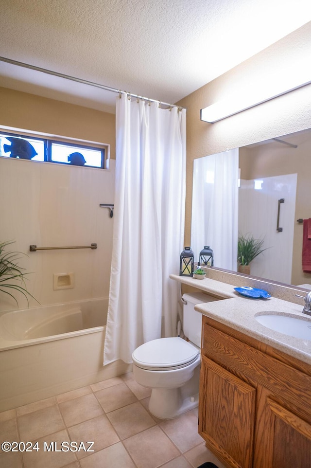 full bathroom with vanity, tile patterned flooring, toilet, a textured ceiling, and shower / tub combo