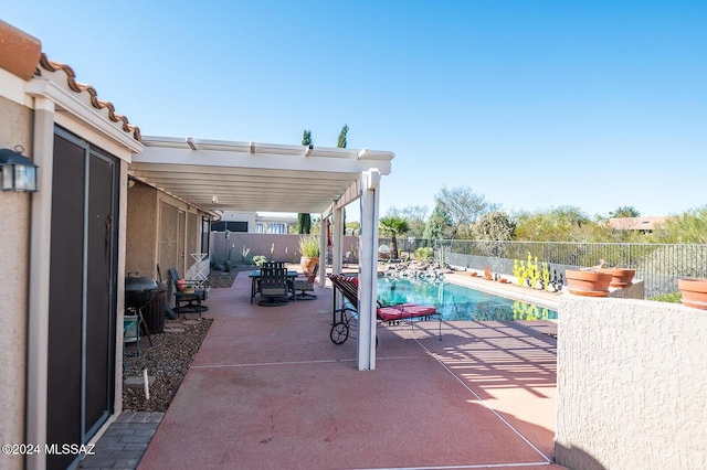 view of patio with a fenced in pool