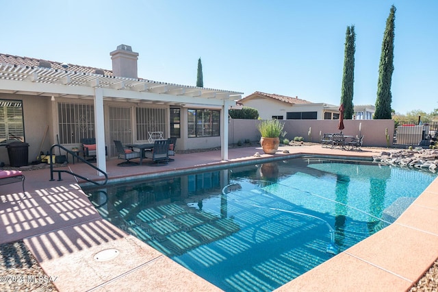 view of pool with a pergola and a patio