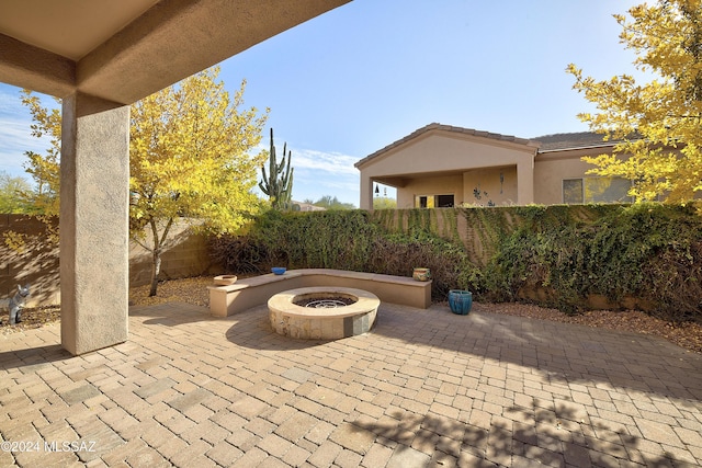 view of patio / terrace featuring a fire pit