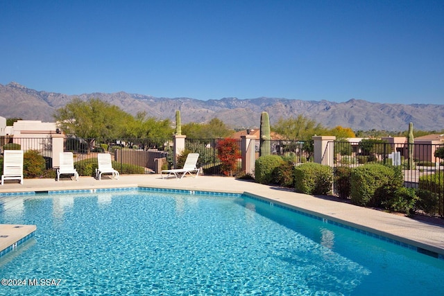 view of pool with a mountain view