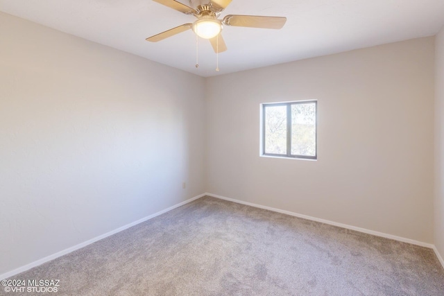 unfurnished room featuring ceiling fan and carpet flooring