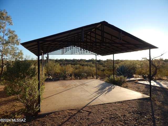 view of parking / parking lot featuring a carport