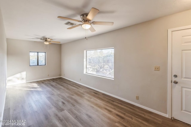 unfurnished room featuring ceiling fan and wood-type flooring