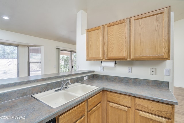 kitchen with sink and light brown cabinetry