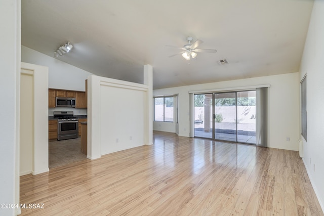 unfurnished living room with ceiling fan, light hardwood / wood-style flooring, and lofted ceiling