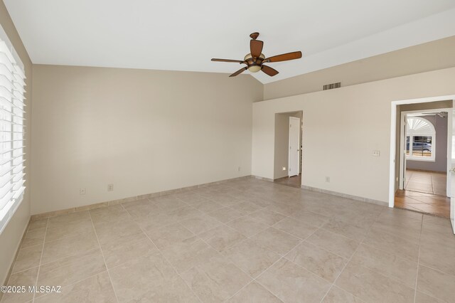 bathroom with a shower stall, a spacious closet, tile patterned flooring, an inviting chandelier, and vanity