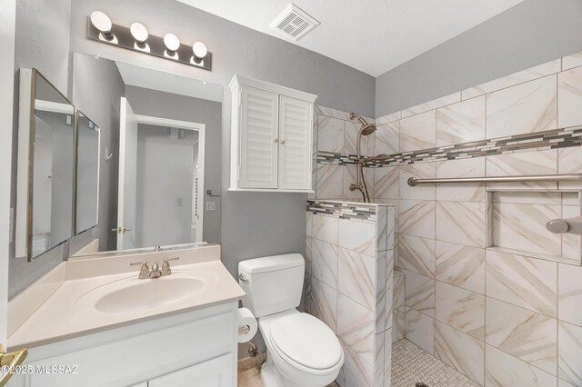 washroom with cabinet space, independent washer and dryer, and light tile patterned floors