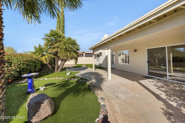 view of yard featuring a patio area and a fenced backyard