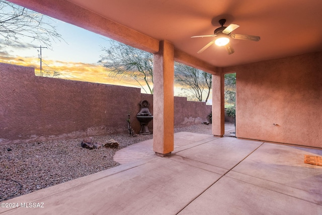 patio terrace at dusk with ceiling fan