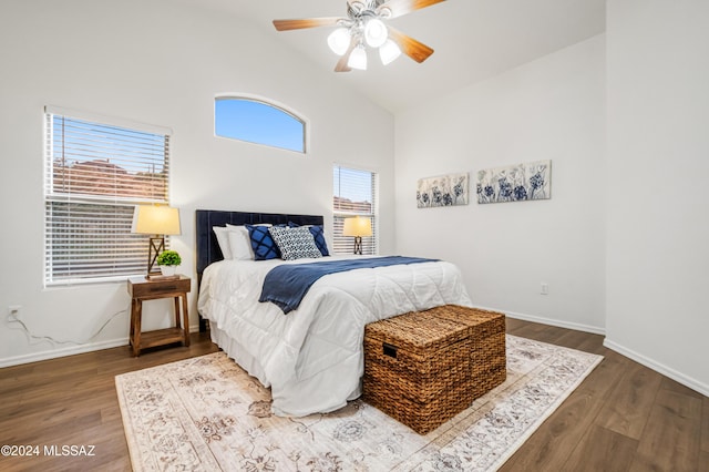 bedroom featuring ceiling fan, wood-type flooring, and lofted ceiling